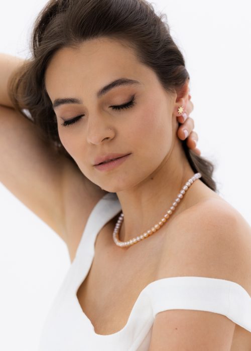 Cercei din aur cu simbolul soarelui,